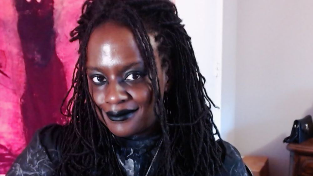 sheron smiling for webcam camera at desktop