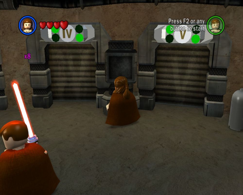 a screenshot of lego star wars: the complete saga, with the roman numerals IV and V on the doors for episode 4 and 5