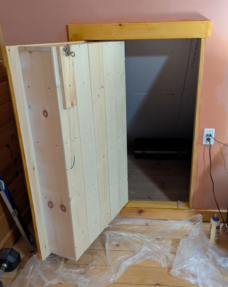 The same bookcase in the skeet above, swung open to reveal a secret door. 