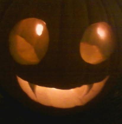 a jack o lantern with eyes cut at various depths to suggest gems when illuminated