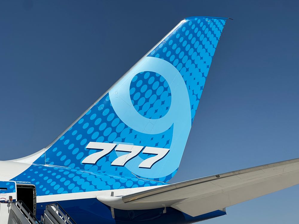 The stylized blue tail of Boeing’s 777-9 test aircraft. 