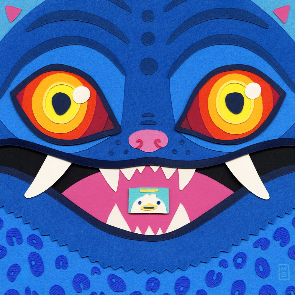 A paper collage showing a closeup of a wide-eyed blue tiger from KPop Demon Hunters.