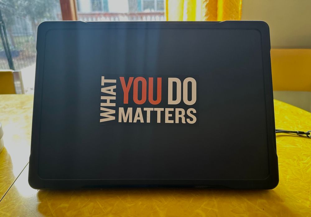 Laptop with the a sticker that reads “What you do matters” 