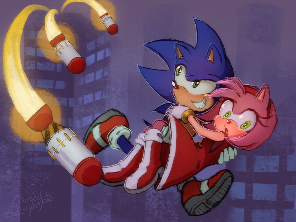 Sonic the hedgehog carries Amy Rose as they flee three missiles being launched from the too of a building. 
Sonic looks back at the missiles snarkly while Amy is looking down; concerned about where they’ll land. They are maybe 100 feet in the air. 
The background is a simple city landscape.