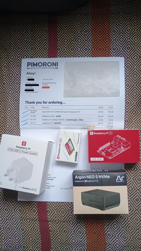 Raspberry Pi components: Pi5 board, Argon NEO case, NVMe SSD card and USB-C power supply.