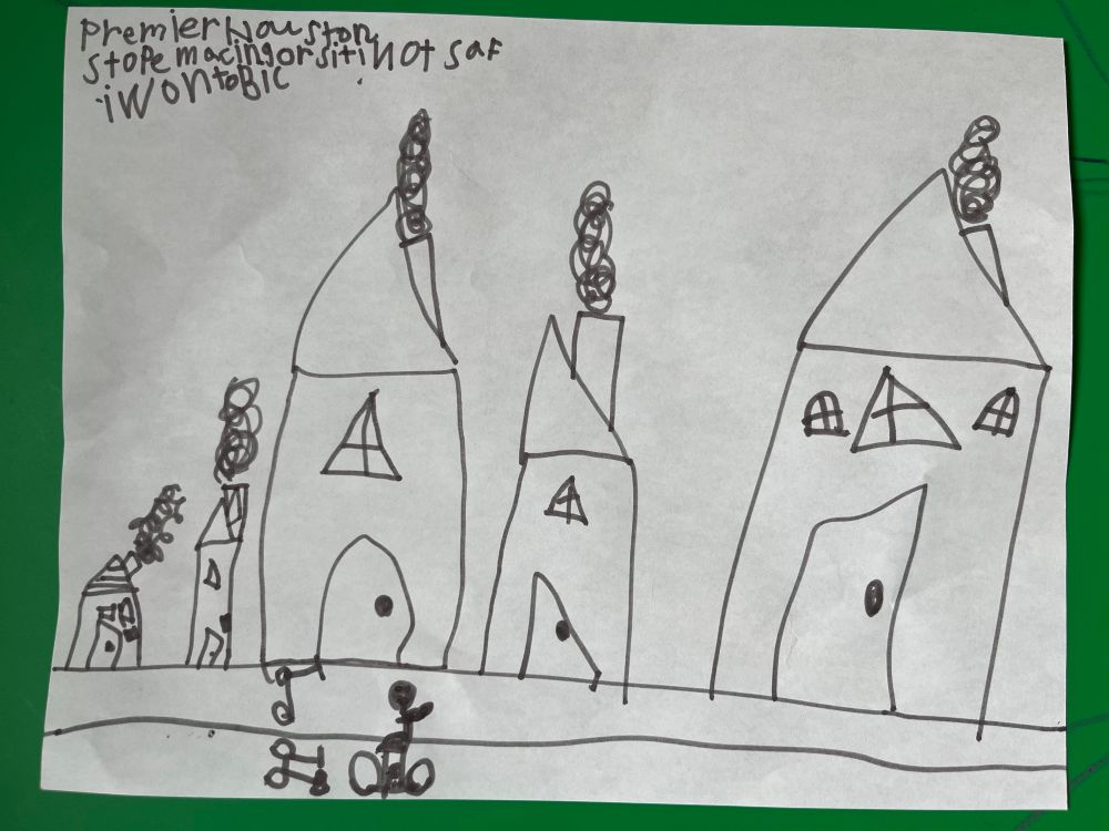 A child’s drawing of a bike lane and scooter lane side by side next to three houses. A child rides their two-wheeler in the bike lane.

The text at the top reads “Premier Houston stop macing or citi not saf I wonto bic”
