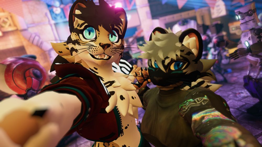 Ricky, my ocelot, and Hazey's new cat pose together in front of a robot rock venue in VrChat