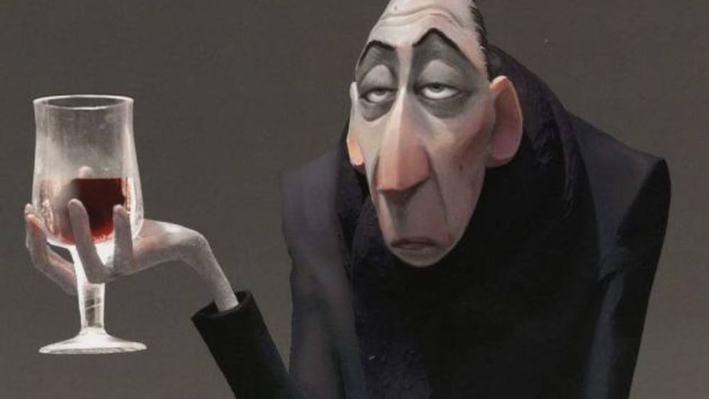 Antón Ego holding a glass of red wine 