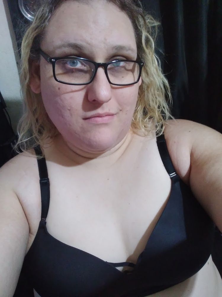 A developing trans goddess knowing her true power is rising wearing just a black bra still being filled out