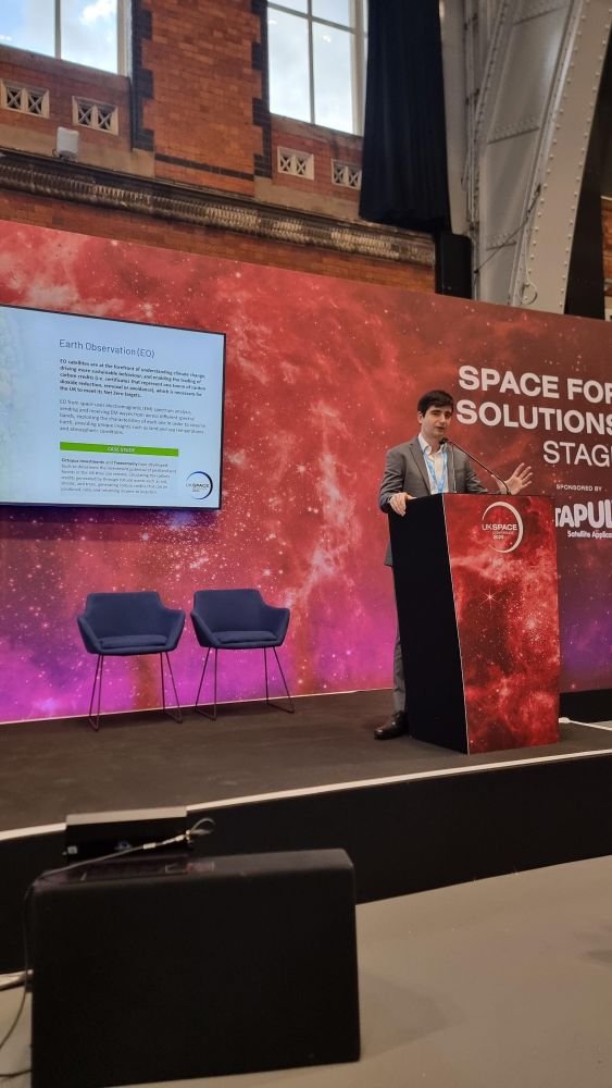Louis Barson giving a presentation of the IOP's new space report at the UK Space Conference.