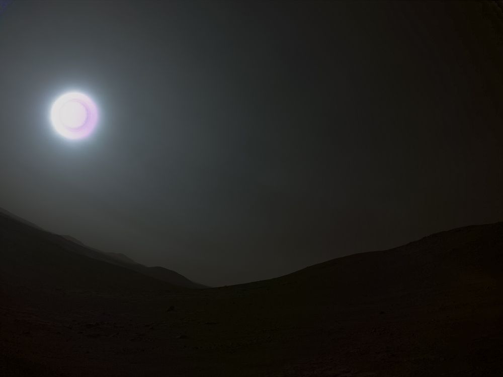 Afternoon image from Perseverance showing the sun low in the sky. The landscape is mostly dark because of the short exposure. 
The sun is overexposed and has a weird dark purple ring on it that is probably caused by the correlated double sampling applied by the camera. 
Credit: NASA/JPL-Caltech/Simeon Schmauß