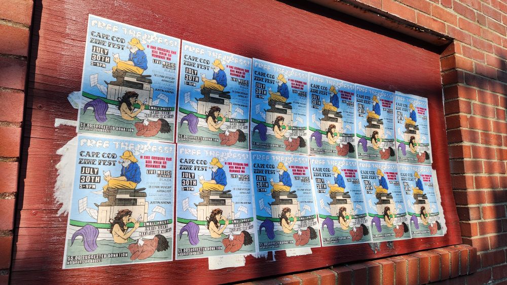 Signs promoting the Cape Cod Zine Fest