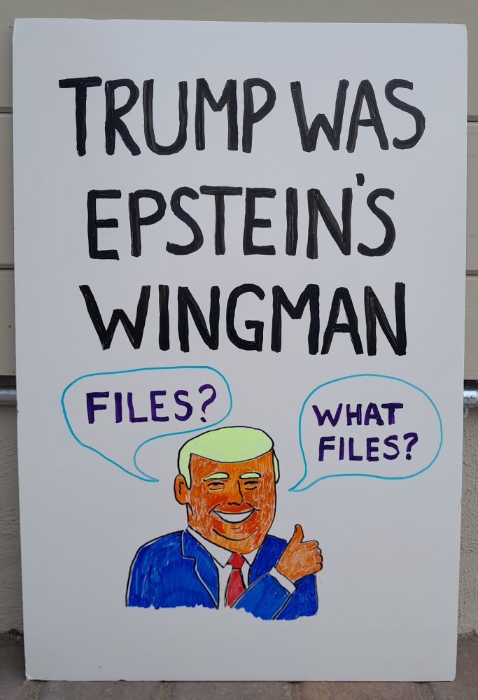 A hand drawn sign on a dry erase foam core board featuring a grinning, thumbs up Trump saying, 