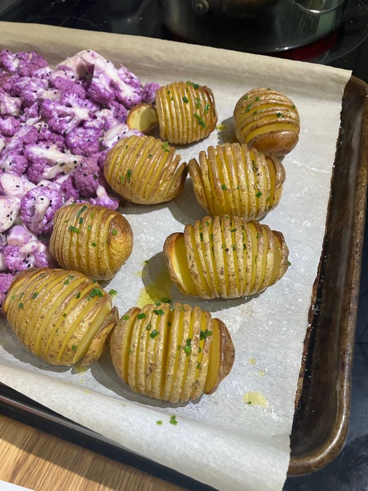 A pan of roasted hasselback potatoes 