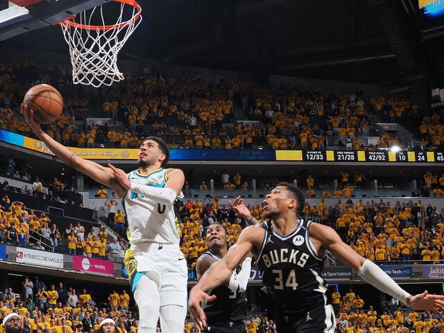 Pacers wearing the white city edition alternates while eliminating Milwaukee in round 1