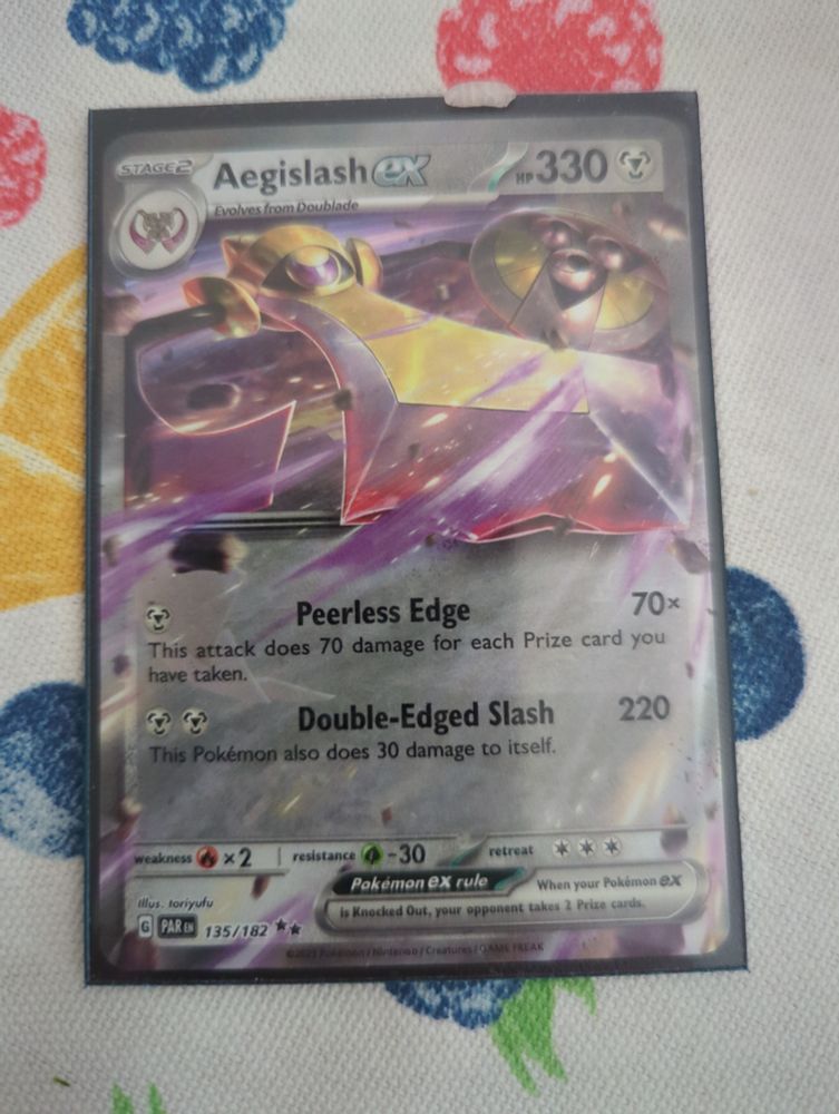 Aegislash EX Pokemon card. Does 70 damage for each prize card collected for 1 energy or 220 damage (and 30 damage to itself) for 2 energy.