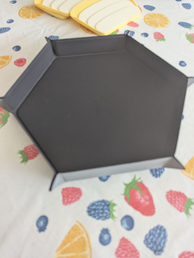 Reversible dice tray that folds flat but holds shape via magnets.