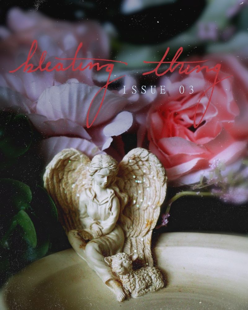 A soapdish sits under a canopy of fabric roses, the dish carved with the small figurine of an angel in a frock gazing down at the lamb nestled at her feet. Above their heads, the magazine banner reads: Bleating Thing Issue 03