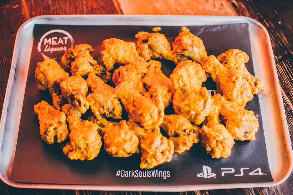 A plate of PS4-branded chicken wings with the hashtag #DarkSoulsWings