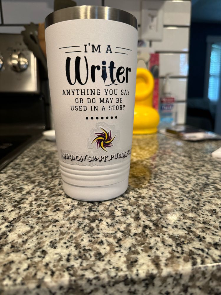 Tumbler that says, “I’m a writer; anything you say or do may be used in a story,” now has a “shadow spark publishing” sticker with the SSP logo
