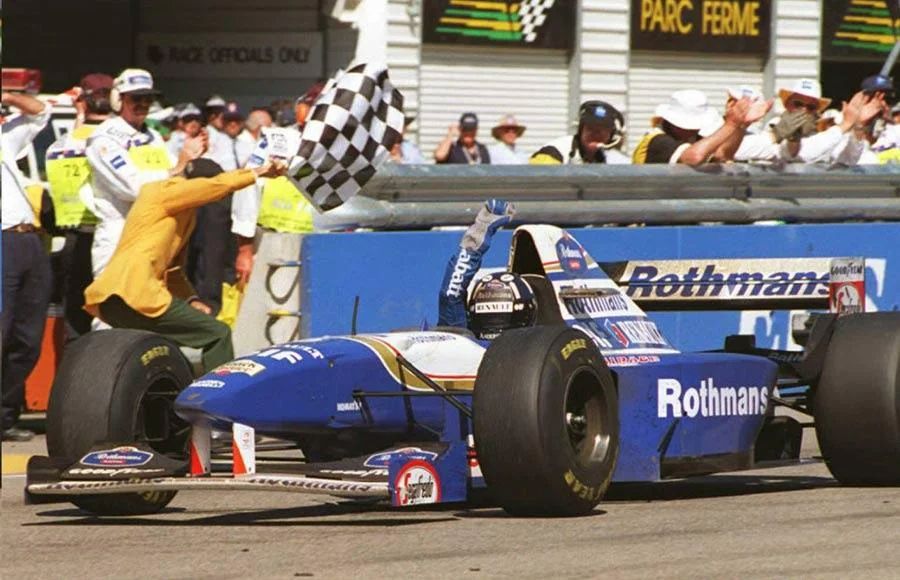 Damon Hill winning the 1995 Japanese GP with a stunning drive he finished two laps up on the field. Here, Damon raises his Labatt-clad arm in triumph.