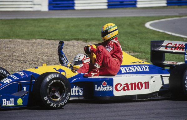 The victorious Nigel Mansell giving Aryton Senna a lift back to the pits at the 1991 British GP after Senna ran out of fuel.