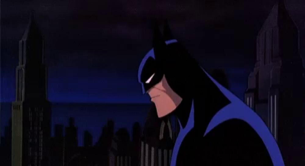 a cartoon of batman standing in front of a city