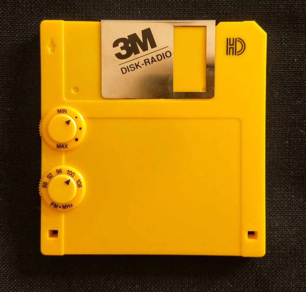 A 3M Disk Radio, an FM radio for use with wired earbuds, housed in a yellow 3½-inch, 1.44 MByte floppy disk. A promotional item.

Wouldn't be surprised if it contains a Philips TDA7000 FM receiver from 1983.