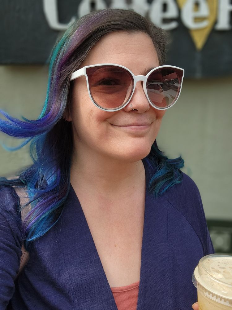 Selfie showing of hair dyed purple, blue and teal