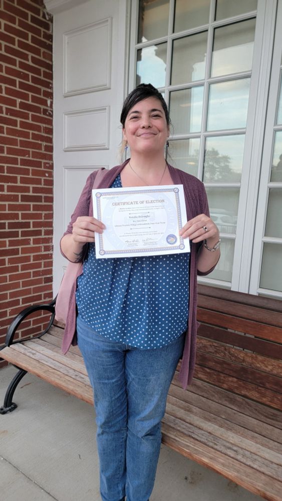 Me with my official library board trustee election certificate 