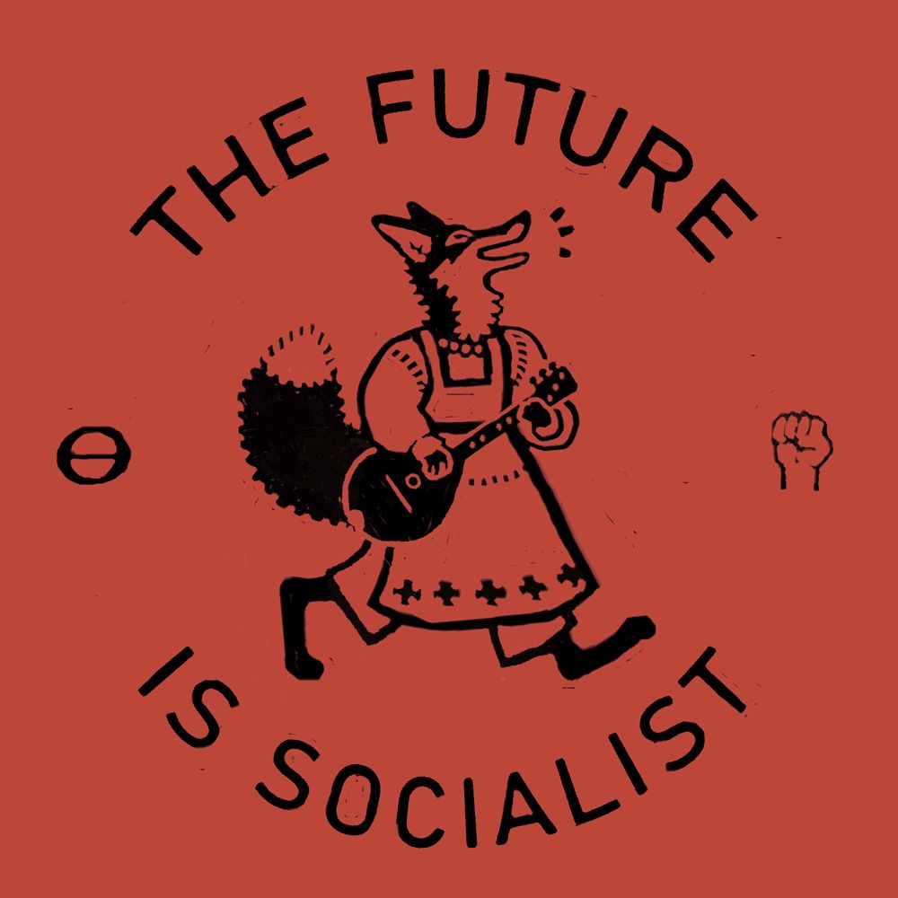 red background with black print. a fox walks upright and vocalizes triumphantly while carrying a string instrument (bouzouki) and wearing an apron with decorative details. text reads "the future is socialist" with the Ron Cobb ecology symbol and a raised fist symbol.