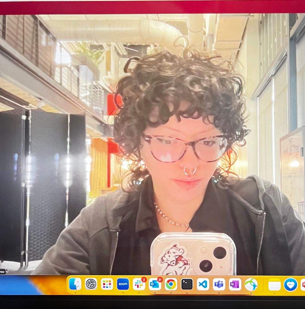 Zoom selfie of curly haired girl