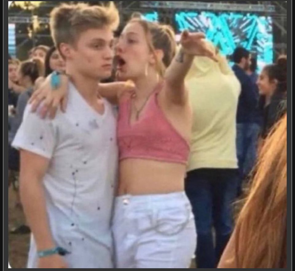 Annoying drunk girl yells in dude’s ear as he stares into the distance with a glazed look.