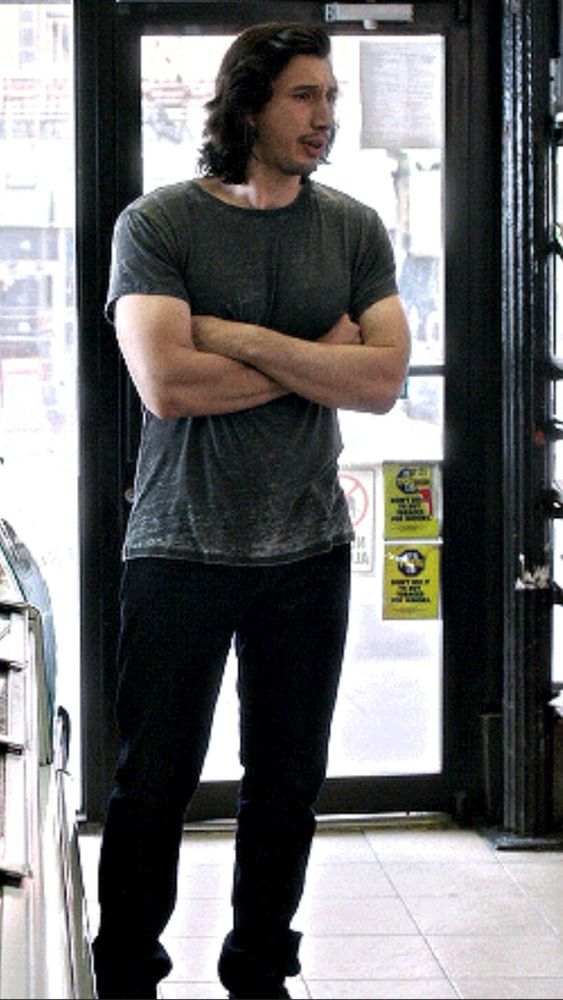 Adam Driver, huge, in a doorway 