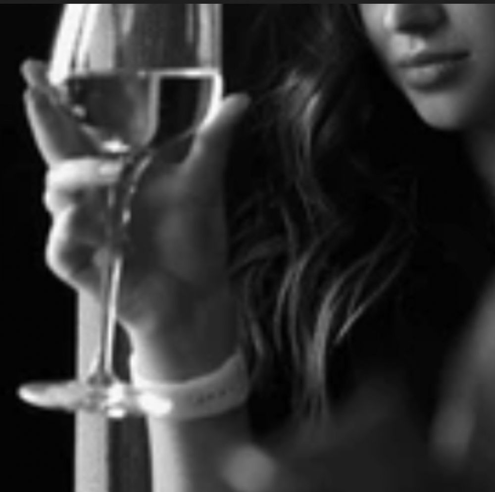 Woman holding wine glass 