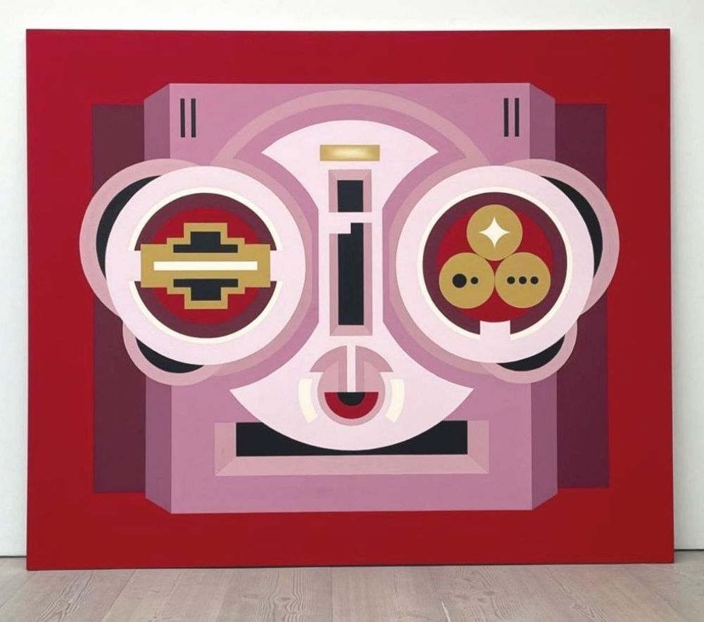 Image: Hazel O'Sullivan: Lagore Crannóg, 2025, acrylic on canvas   250 x 300cm | very large canvas; we see it, face-on, leaning against a wall; background is a strong red; what is depicted is hard to decipher; it could be taken as the head of a robot wearing glam sunglasses with various geometrical shapes in its eyes … though the mouth is more of an eye…; the palette is is largely pale purple and white, but with reds, ochres, black, purple • “Factory Made at Green On Red Gallery, Dublin, looks at a common interest in a number of contemporary art practices that celebrate the use of industrial materials and tools, as much as possible in their existing states, with the minimum of intervention, to a variety of artistic ends, starting with German artist Kirstin Arndt.    It echoes a theme in the recently-visited Room 1 in the Neue Nationalgalerie, Berlin, called Aus Der Fabrik / From the Factory which celebrates the work of two leading 20th century artists Donald Judd and Charlotte…”