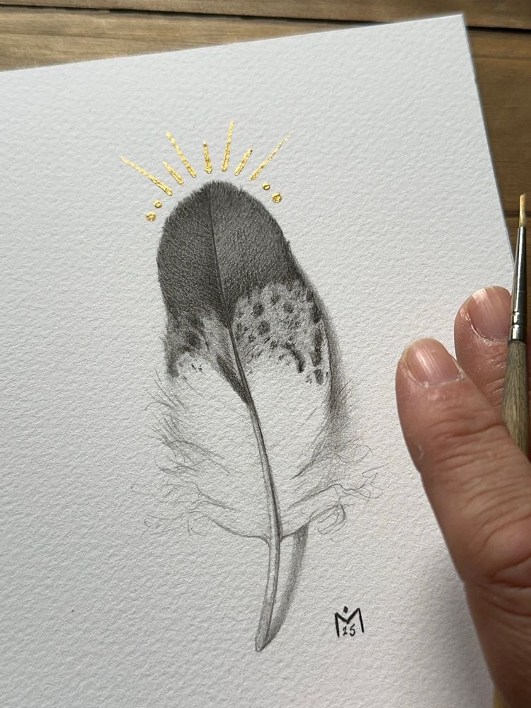 Gold embellished print of an eagle feather drawing