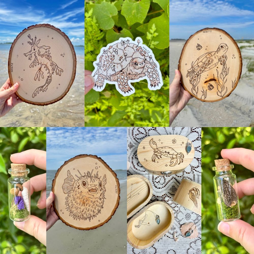 Collage of 7 images including a leafy Seadragon woodburning held in front of the blue sky and ocean, a sticker of a pyrography tortoise with moss, flowers and mushrooms on its shell held in front of green leaves and ferns, a sea turtle swimming through seaweed with fishies woodburning held in front of the beach, a glass vial containing little mushrooms with a seashell, moss and purple flower held in front of green leaves, a pufferfish woodburning held in front of the ocean, 3 cancer inspired wood burned trinket boxes and 3 aquamarine necklaces laying on lace with crab shells and claws, a glass vial containing a morel mushroom with moss and dried baby’s breath flowers held in front of green leaves