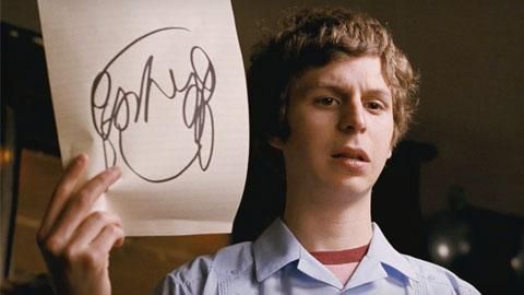 Michael Cera as Scott Pilgrim holding up a doodle of alt girl hair. 