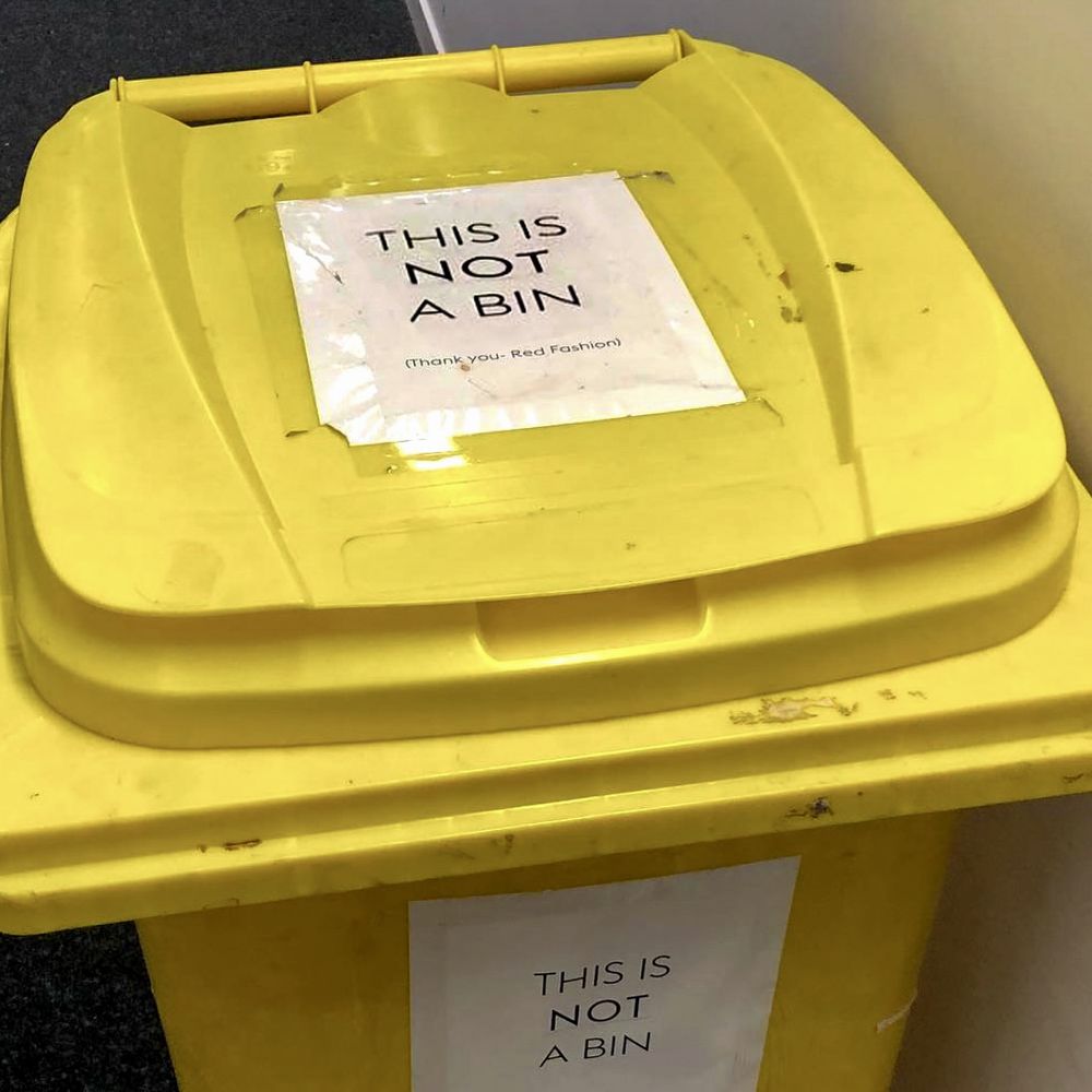 A bin with a sign saying “this is not a bin” on it. 