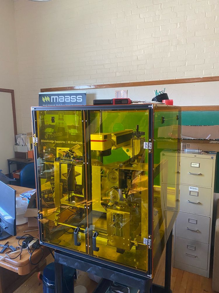 Metal Polymer 3D Printer prototype machine, made by MAASS. Added the enclosure to assist with fume mitigation from laser and resin. Safety first! 