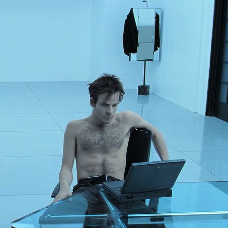 Shirtless Stephen Dorff as Deacon Frost in the 1998 movie Blade gazes broodingly at a very chunky 1990s laptop. It is not even plugged in, which shows that he doesn't play by the rules, because those laptops did not have a long battery life back then.