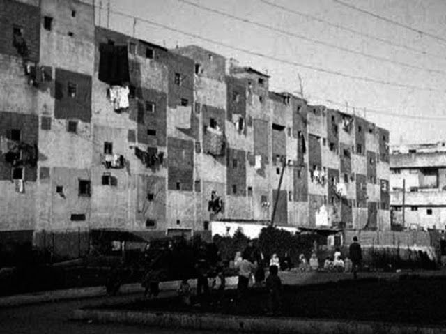Nid d’abeille building in Casablanca many years after construction, with all double height balconies bricked in by residents