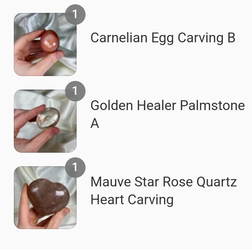 Three photos on the left, with text descriptions to the right. Top photo is a pale red carnelian crystal carved into an egg shape. Middle photo is a small clear quartz oval palmstone with streaks of golden iron inclusions. Bottom photo is a deep mauve crystal carved into a puffed heart shape. 