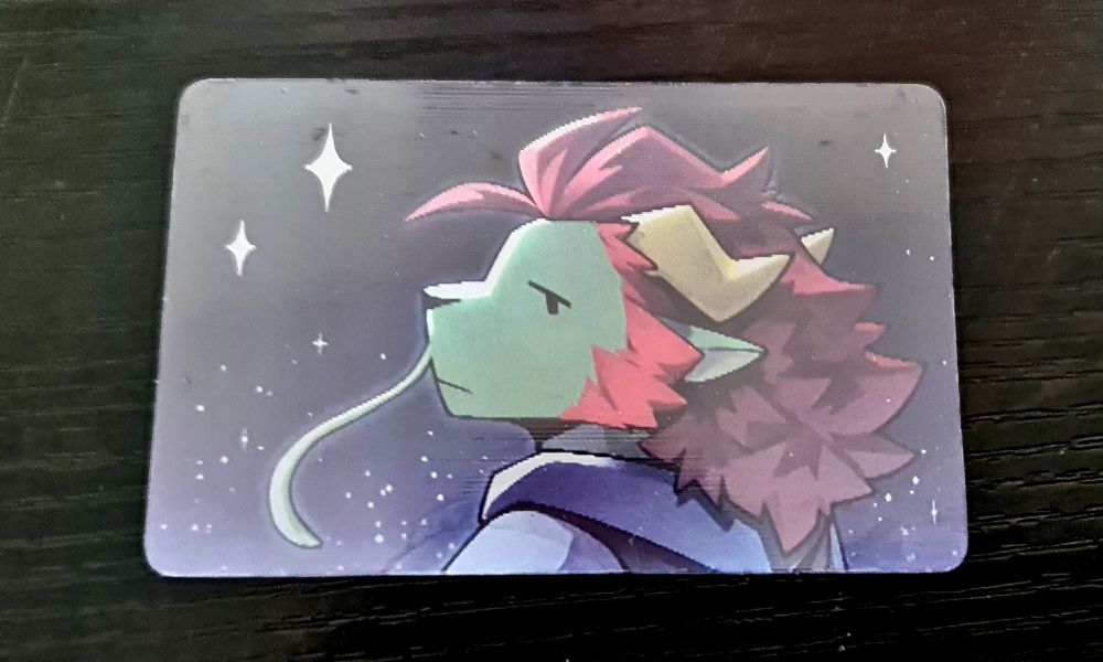 a lenticular card of dragonsol in front of a starry background