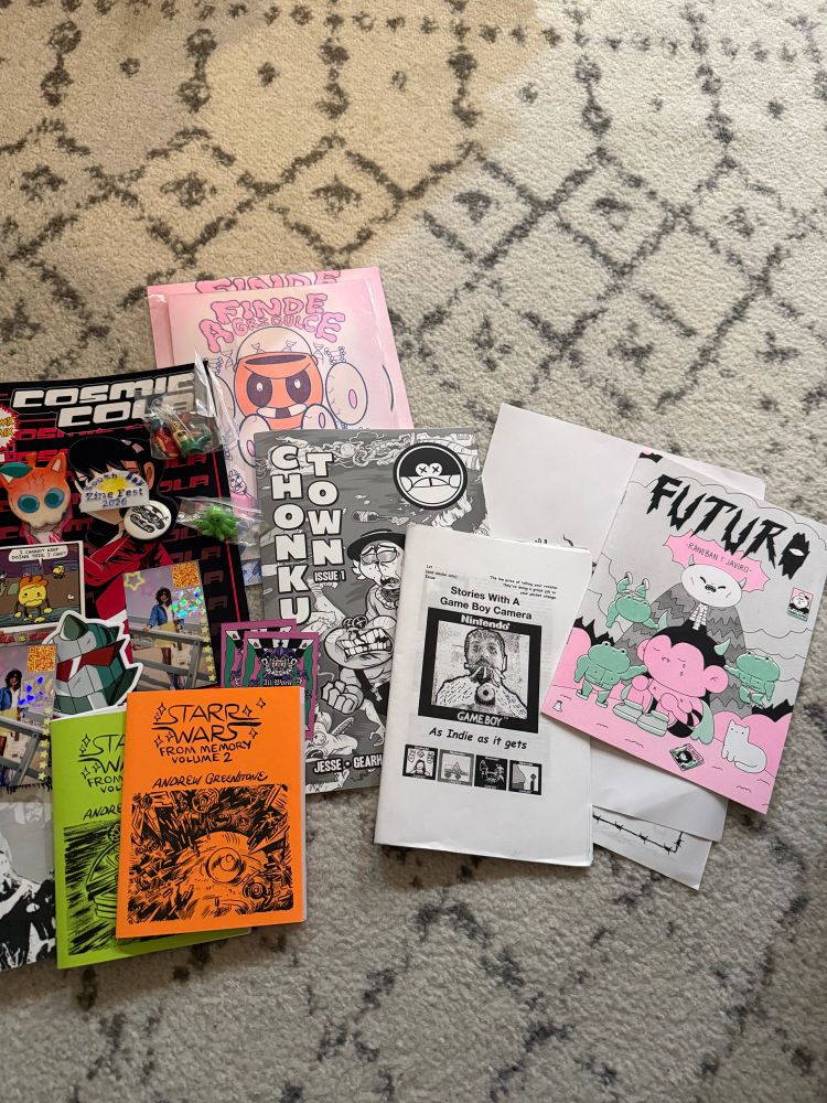 Various zines and stickers on the floor of my front room. 
