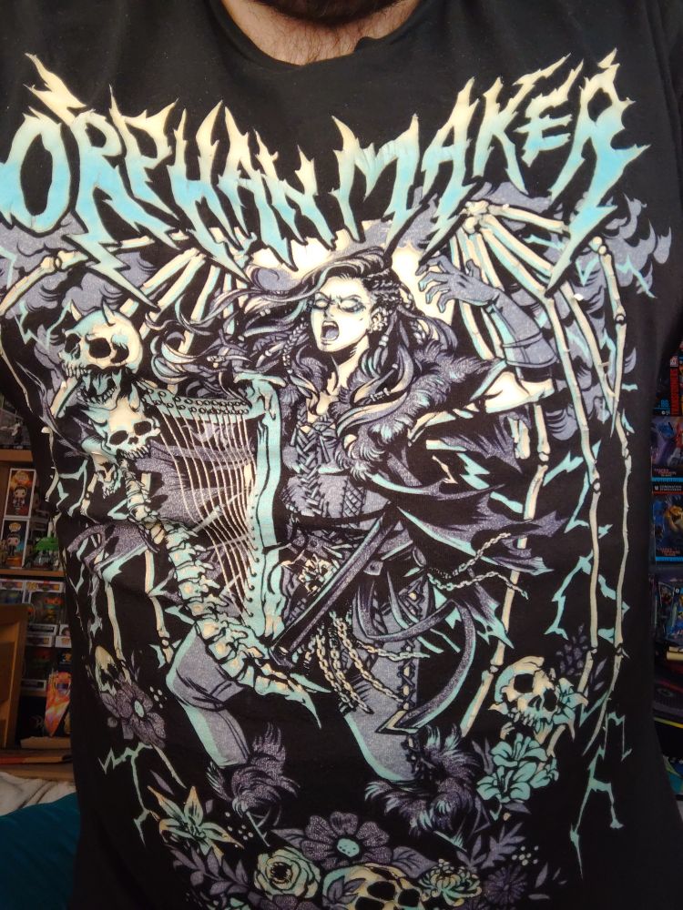 Critical Role T-shirt featuring artwork of Ashley Johnson's character Yasha with her tribe name Orphanmaker above her