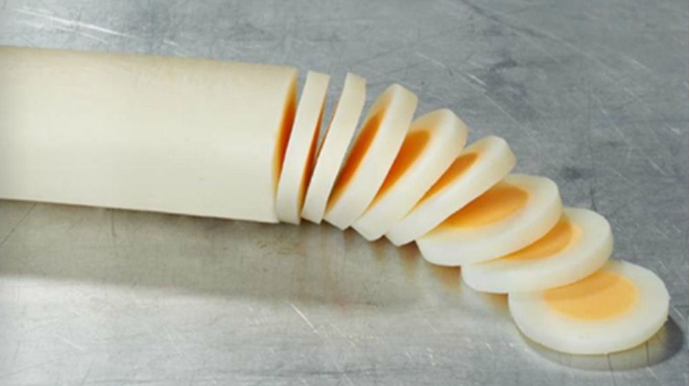 A tube of cylindrical long egg used for restaurants to save time for egg dishes. The tube shaped long egg is cut into slices