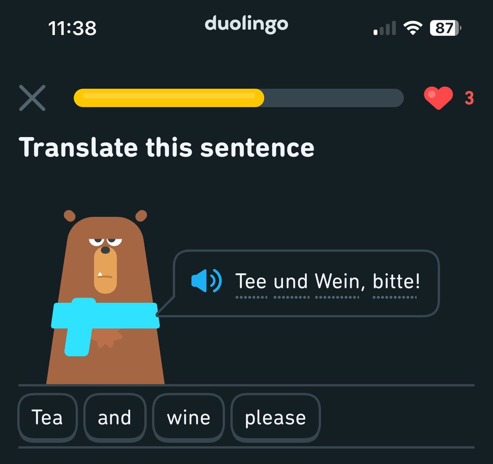 A Duolingo language app exercise. It’s a English learning German activity. It says Tee and Wein, bitte! Which translates to Tea and wine please.

