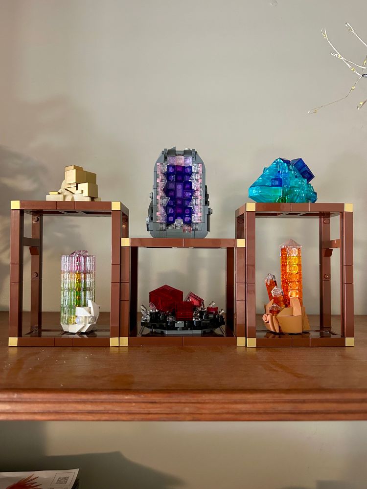 A display of different minerals constructed from LEGO blocks ranging from pyrite to amythest